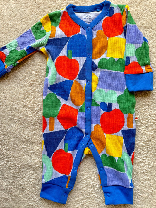 Jumper - Multi coloured shapes on blue